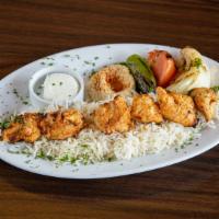 Chicken Kebab Plate · Skewered cubes of marinated, charbroiled chicken tender, served with hummus, rice (pilaf) ga...
