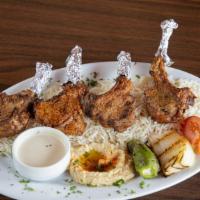 Lamb Chops · Succulent baby lamb chops of four marinated and charbroiled over an open flame and served wi...