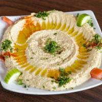 Hummus · A smooth medley of crushed chickpea, garlic, lemon juice, and tahini sauce, drizzled with ol...