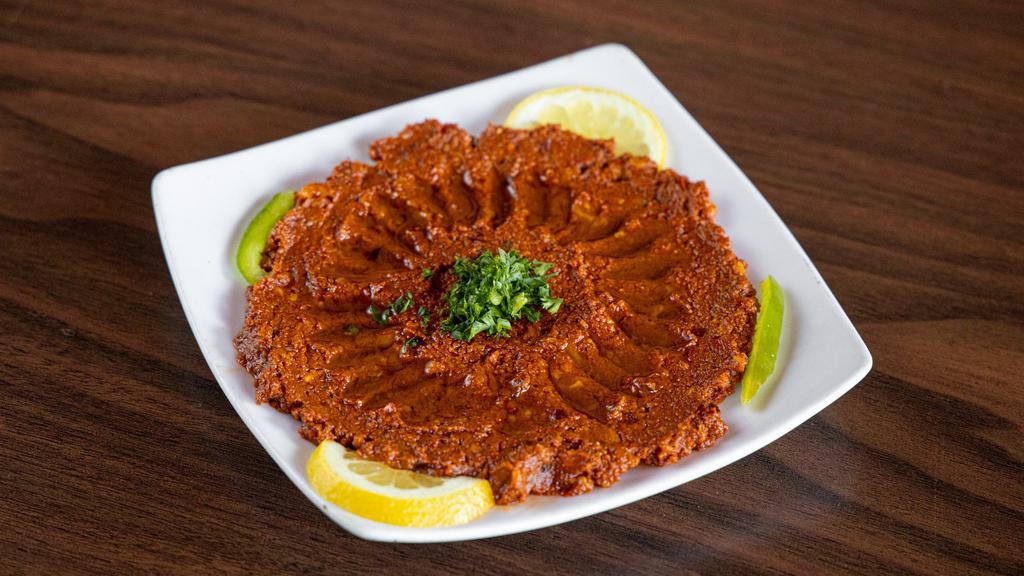 Muhammara · a spread of walnuts and fine roasted red peppers.
