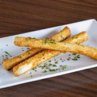 Sigara Borek · Fillo dough filled with parsley, herbs, feta, and mozzarella cheese.