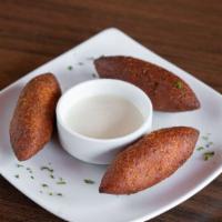 Içli Köfte (Fried Kibbeh) · Fresh ground beef mixed with cracked wheat, spices, and onions stuffed with ground beef.