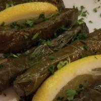 Vegetarian Grape Leaves  · A mixture of rice, finely diced tomato, parsley, onion grilled in grape leaves and slowly co...