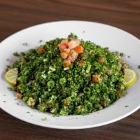 Tabouleh · Chopped fresh parsley mixed with bulgar (crushed wheat), chopped green onion, tomato, fresh ...