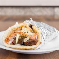 Gyro Wrap · Tasty gyro meat stuffed in a soft pita with fresh tomatoes and tzatziki sauce.