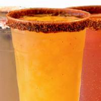 Chamango Mich-Agua · Our Chamango Michelada (minus the alcohol). Pineapple Mango Agua Fresca, Chamoy & Tajin.