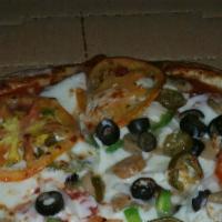 Veggie Pizza · Topped with mushrooms, tomatoes, green peppers, onions and olives.