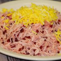 Zereshk Polo · A tantalizing taste of sour barberries and saffron in a mixture of basmati rice, served with...
