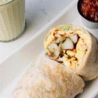 The Burrito · Scrambled eggs, roasted potatoes, avocado spread, chihuahua cheese wrapped in a flour tortil...
