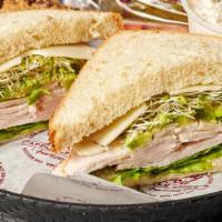 Turkey Avocado · Oven-roasted turkey breast, sliced avocado, sprouts, and swiss cheese on our fresh baked hon...