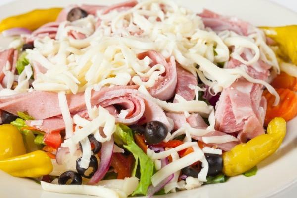 Antipasto Misto Salad · Italian salami, ham, mortadella thinly sliced and placed on a bed of romaine lettuce with marinated vegetables, tomatoes, black olives & onions topped with mozzarella cheese & served with our homemade Italian dressing