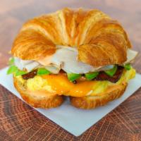 Croissant, Bacon, Turkey, Avocado, Egg, & Cheddar Sandwich · 2 scrambled eggs, melted Cheddar cheese, crispy bacon, sliced smoked turkey, avocado, and Sr...