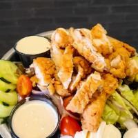 Crispy Chicken Salad · Mixed greens, tomatoes, red onions, cucumbers, chopped eggs, pepper jack cheese, topped with...