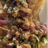 Ahi Nachos · House-made wonton chips topped with soy-ginger marinated ahi, seaweed salad, avocado, green ...