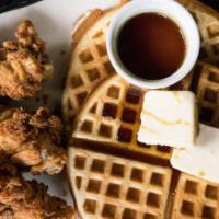 Chicken & Waffles · Two waffles, mixed berries, maple syrup and fried chicken breast.