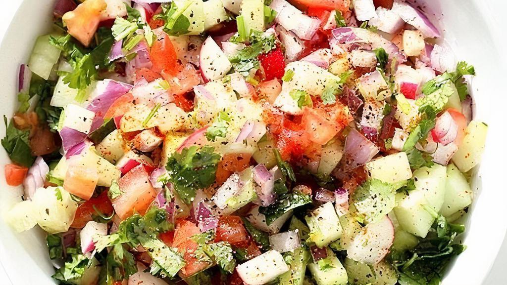 Lentil Kuchumber Salad · Vegan. Gluten-free salad with chopped onions, tomatoes, cucumber, and lentil with lemon-vinaigrette dressing.