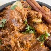 Lamb Rogan Josh · Classic stewed lamb cooked in dry ginger, fennel seeds, onion, and saffron.