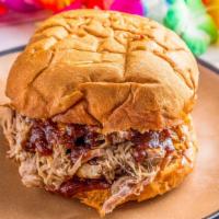 Killer Kalua Pork Sandwich · A portion of succulent roasted pork piled high on our jumbo roll and smothered with BBQ sauc...