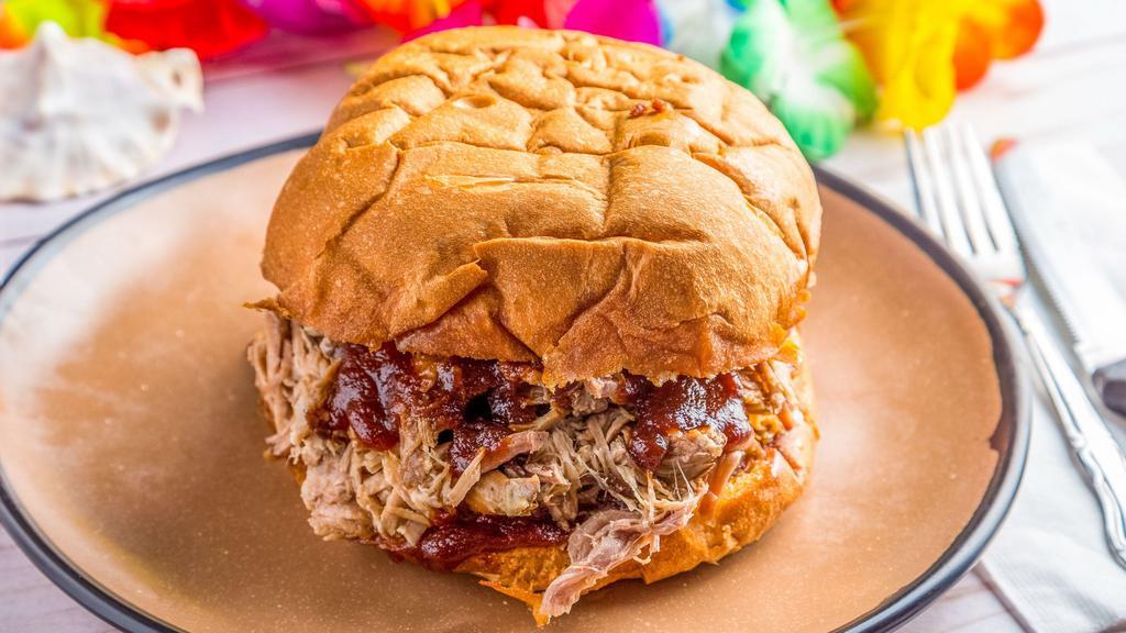Killer Kalua Pork Sandwich · A portion of succulent roasted pork piled high on our jumbo roll and smothered with BBQ sauce. Served on a Hawaiian roll baked fresh.