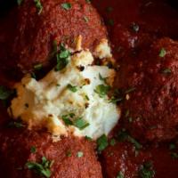 Nonna'S Meatballs · Lean sirloin with fresh herbs and Parmigiano-Reggiano, served with tomato sauce & seasoned r...