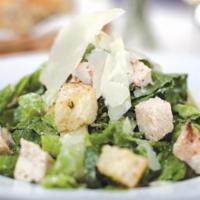 Caesar Salad · Parmesan, shaved Grana-Padano, toasted garlic, croutons, and Caesar* dressing