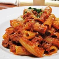 Rigatoni Bolognese · Rigatoni tossed in a slow simmered ragu of fresh sirloin and pork, tomato sauce, garlic, her...