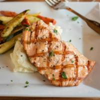 Grilled Salmon · Fresh Atlantic salmon with a light chardonnay sauce, served with garlic mashed potatoes and ...