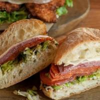 The Club Panini · Chicken breast, smoked bacon, avocado, provolone, tomatoes, leaf lettuce, aioli