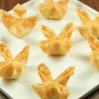 Cheese Wonton · Deep-fried wonton stuffed with cream cheese, served with sweet and sour sauce.