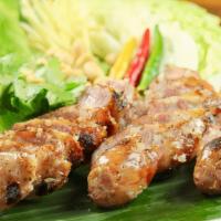 E Sarn Sausage · Northeastern Thailand-style sausage served with fresh ginger, peanut, and cabbage.