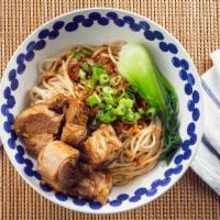 Pork Ribs Dry Sauced Noodle · Mild spicy noodle served dry with sweet and spicy pork short ribs, buk choy & green onions.