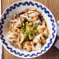 Spicy Pork Wonton (Dry Sauce) · Pork wontons served dry & topped with chili oil and green onions.