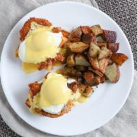 Chicken & Waffle Benedict · Crispy chicken, poached eggs and hollandaise sauce on a waffle served with hash browns or po...