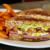The Breakfast Club · Ham, bacon, avocado, eggs, tomato, and cheddar served with potatoes or hash browns.