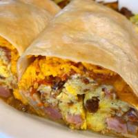 Breakfast Burrito · Ham, bacon or sausage, eggs, cheddar, beans, and salsa served with potatoes or hash browns.
