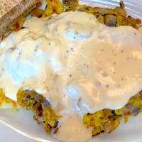 Smothered Hashscram · Hash browns, sausage, scrambled eggs, onions, mushrooms, and country sausage gravy served wi...