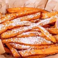 Sweet Potato Fries · Crispy sweet and cooked to perfection, topped with powder sugar.  Served with ranch.