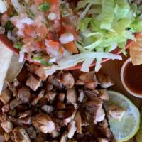 Carne Asada Burrito Bowl · Burrito bowl with carne asada, rice, beans, cheese, pico de gallo, and lettuce.