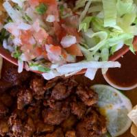 Al Pastor Burrito Bowl $11.25 · Burrito bowl with al pastor, rice, beans, cheese, pico de gallo, and lettuce.