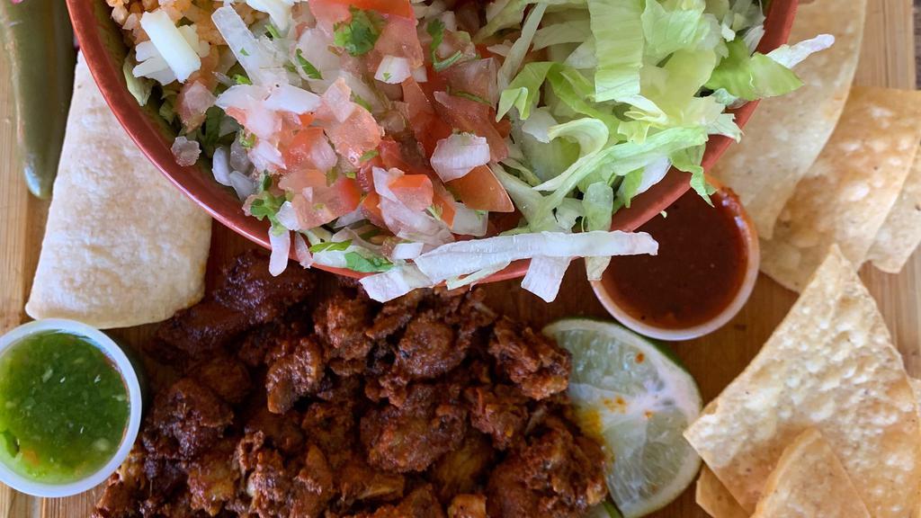 Al Pastor Burrito Bowl $11.25 · Burrito bowl with al pastor, rice, beans, cheese, pico de gallo, and lettuce.