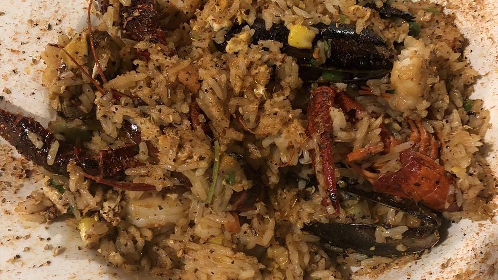 Cajun Seafood Fried Rice · Spicy. Clams, mussels, fish, calamari, shrimp, peas, carrots, eggs, sprinkled w/ Cajun seasoning.