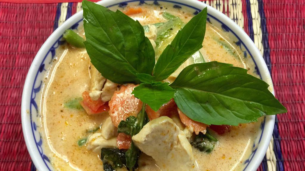 Panang Curry · Sliced chicken, beef or pork in a hot spicy sweet curry paste with green beans, bell peppers and carrots, topped with basil leaves.