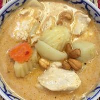 Massaman Curry · Sliced chicken, beef or pork in tasty thick curry paste with potatoes, carrots, onions, and ...