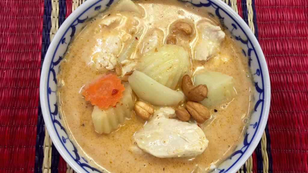 Massaman Curry · Sliced chicken, beef or pork in tasty thick curry paste with potatoes, carrots, onions, and coconut milk. Topped with cashew nuts.
