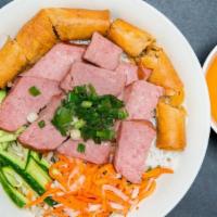 Charbroiled Vietnamese Pork Sausage, Egg Rolls Vermicelli · Rice-vermicelli noodle bowl topped with fresh herbs, vegetables, and served with house speci...