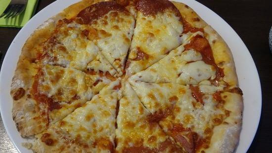 Margarita Pizza · Fresh mozzarella cheese, garlic,  basil, tomatoes.