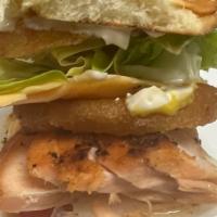 Drummer Kattfish Salmon Burger · Salmon grilled in butter topped with cheese, green onion, lettuce,  tomato pickles and mayo
