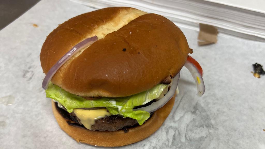 Mushroom Burger · Mushroom burger. This delicious juicy hamburger is topped with mushrooms cheese pickles mayonnaise mustard and lettuce