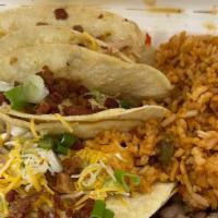 5 Tacos  · With beans and rice,     Topped with Cheese sour cream and green onions.  Red or green salsa...