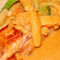 Salmon Yellow Curry · Grilled salmon fillet with vegetable in yellow curry sauce.